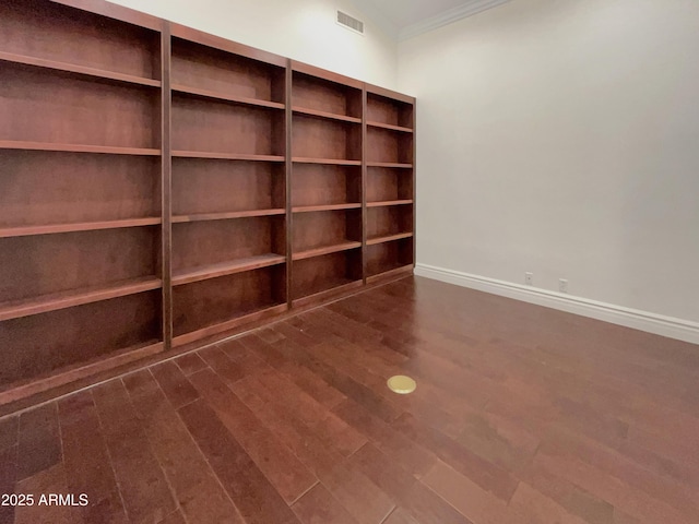 unfurnished room featuring crown molding