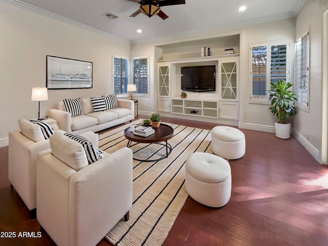 living room with ornamental molding, hardwood / wood-style floors, ceiling fan, and built in shelves