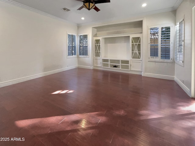 unfurnished living room featuring built in shelves, ceiling fan, ornamental molding, and dark hardwood / wood-style flooring