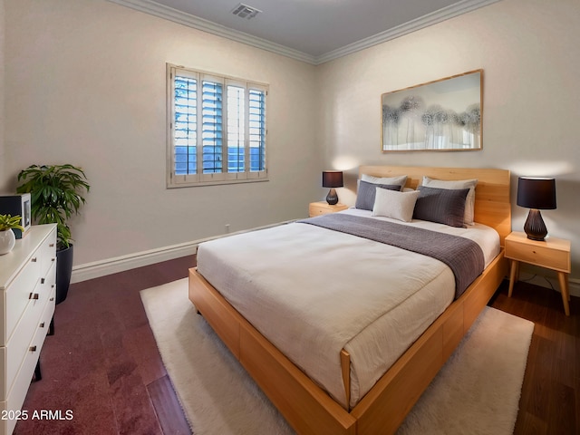 bedroom with crown molding and dark wood-type flooring