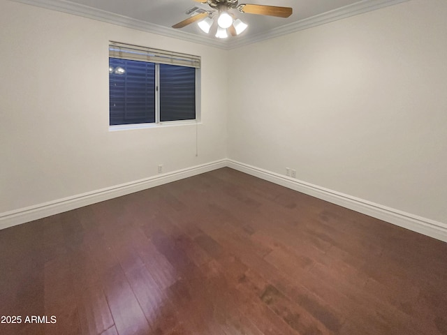 spare room featuring hardwood / wood-style flooring, ornamental molding, and ceiling fan