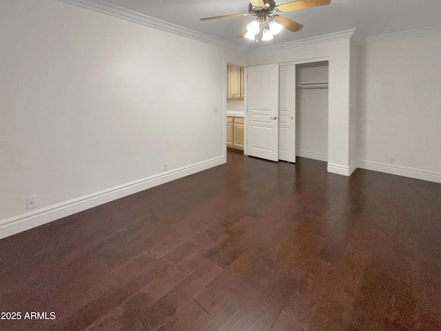 unfurnished bedroom with crown molding, ceiling fan, dark hardwood / wood-style flooring, and a closet