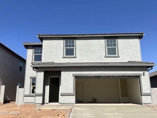 29775 N Oak Dr, Florence, AZ 85132 - view of front of home featuring stucco siding, a garage, and driveway