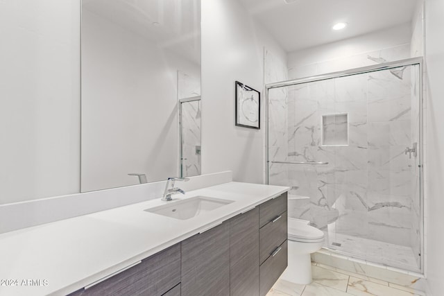 bathroom with vanity, toilet, and an enclosed shower