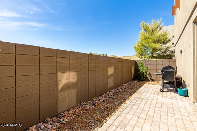 view of patio with a grill