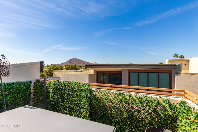 view of side of home with a mountain view