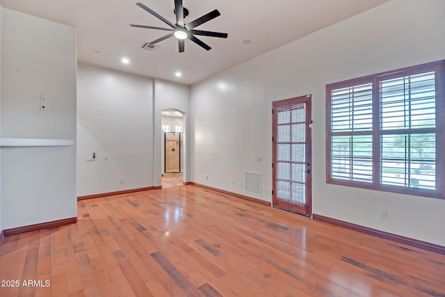 1925 W Tanya Trl, Phoenix, AZ 85086 - spare room with arched walkways, ceiling fan, plenty of natural light, light wood-style floors, and recessed lighting