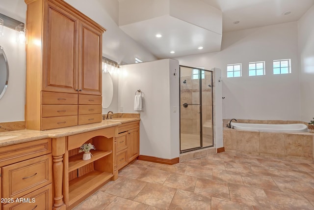 1925 W Tanya Trl, Phoenix, AZ 85086 - bathroom featuring double vanity, a shower stall, a garden tub, stone finish floors, and recessed lighting