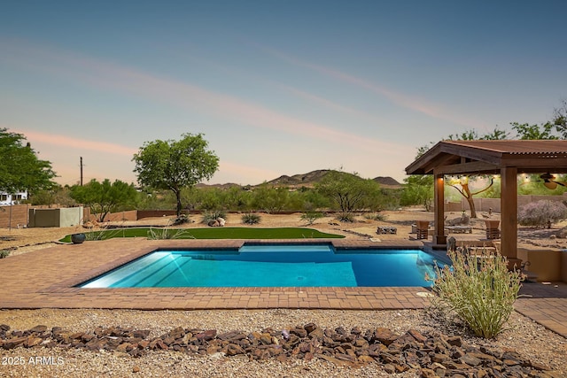 1925 W Tanya Trl, Phoenix, AZ 85086 - pool at dusk featuring an outdoor pool and a patio area