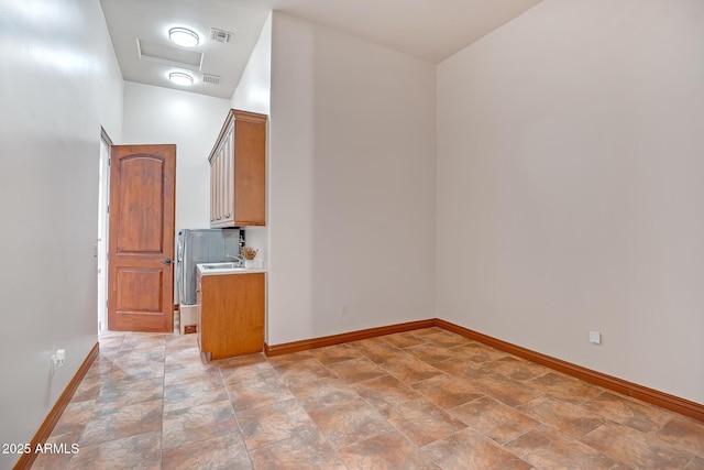 1925 W Tanya Trl, Phoenix, AZ 85086 - empty room with attic access and stone finish floors