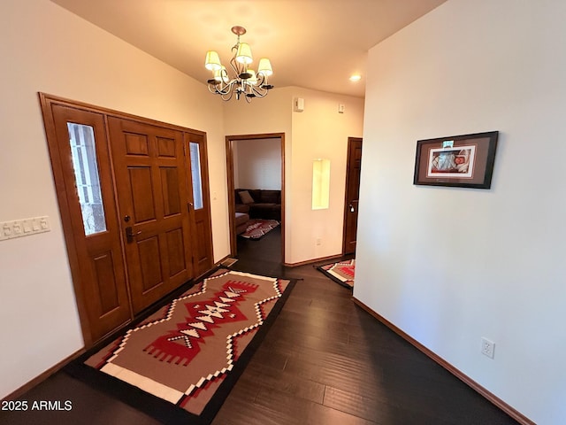 entrance foyer with an inviting chandelier, dark wood-style floors, baseboards, and recessed lighting