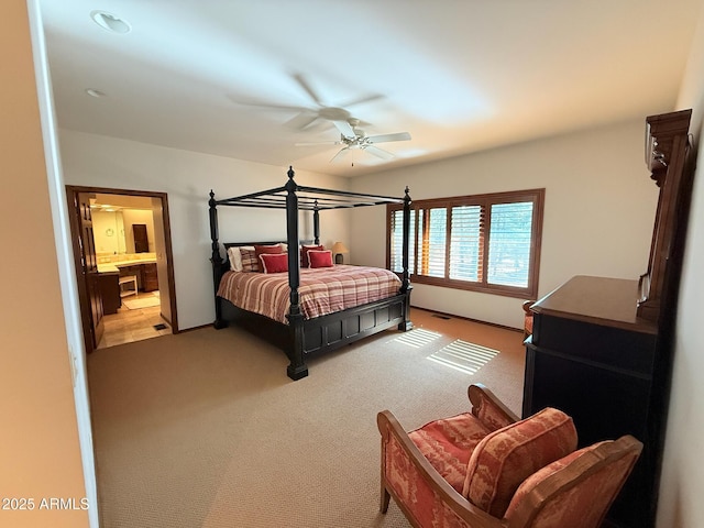 bedroom featuring a ceiling fan, light colored carpet, and visible vents