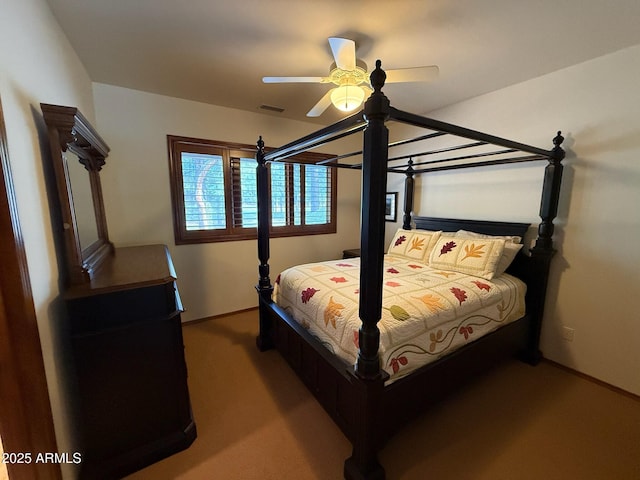 carpeted bedroom featuring a ceiling fan, baseboards, and visible vents