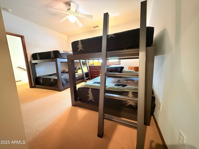 bedroom with visible vents and carpet