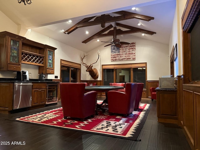 interior space featuring high vaulted ceiling, dark wood-type flooring, a wainscoted wall, beam ceiling, and beverage cooler