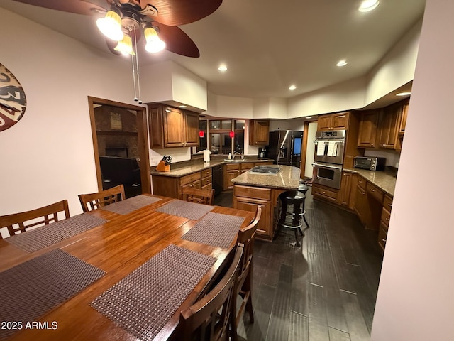 dining space featuring dark wood finished floors, recessed lighting, and a ceiling fan