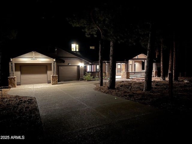 view of front facade with driveway and an attached garage