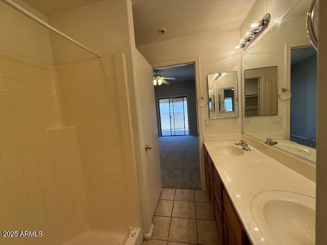 15655 N 29th St, Phoenix, AZ 85032 - full bathroom featuring double vanity, tile patterned floors, tiled shower, and ceiling fan