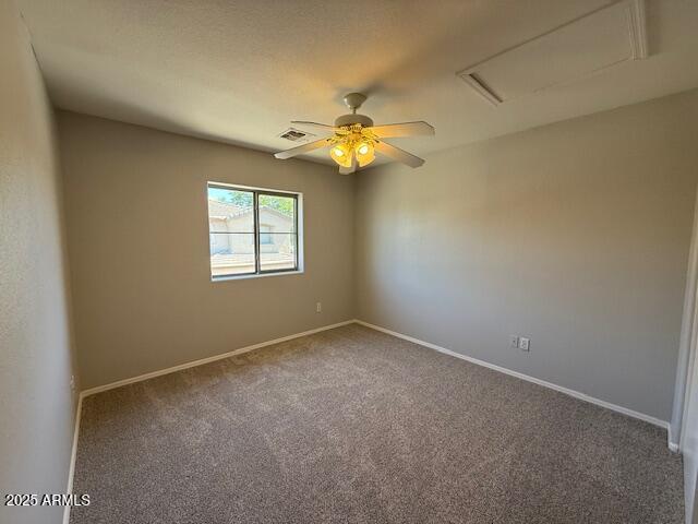15655 N 29th St, Phoenix, AZ 85032 - spare room with carpet, attic access, and ceiling fan