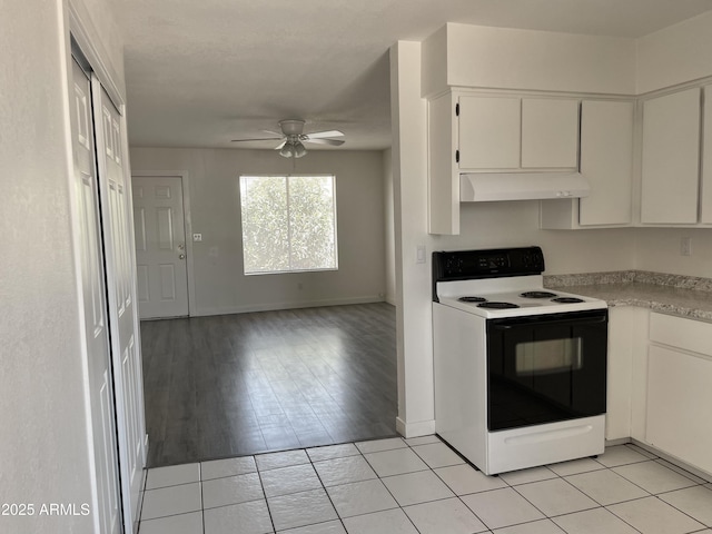 143 S Mountain Rd, Apache Junction, AZ 85120 - kitchen featuring electric range, under cabinet range hood, a ceiling fan, white cabinetry, and light countertops