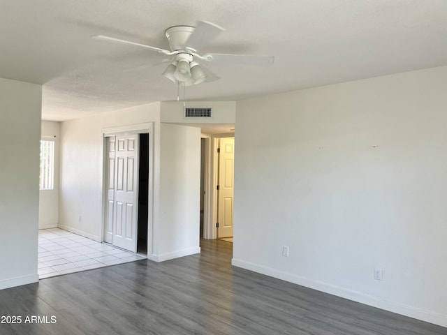 143 S Mountain Rd, Apache Junction, AZ 85120 - empty room with ceiling fan and wood finished floors