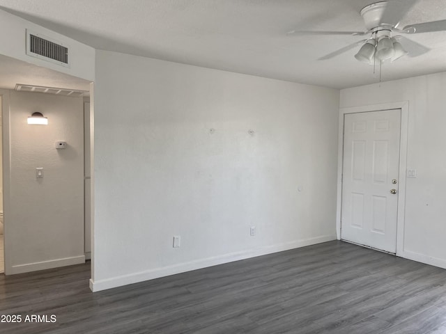 143 S Mountain Rd, Apache Junction, AZ 85120 - spare room with dark wood-style flooring and ceiling fan