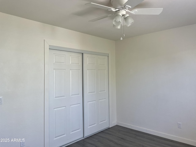 143 S Mountain Rd, Apache Junction, AZ 85120 - unfurnished bedroom featuring dark wood finished floors, a closet, and a ceiling fan
