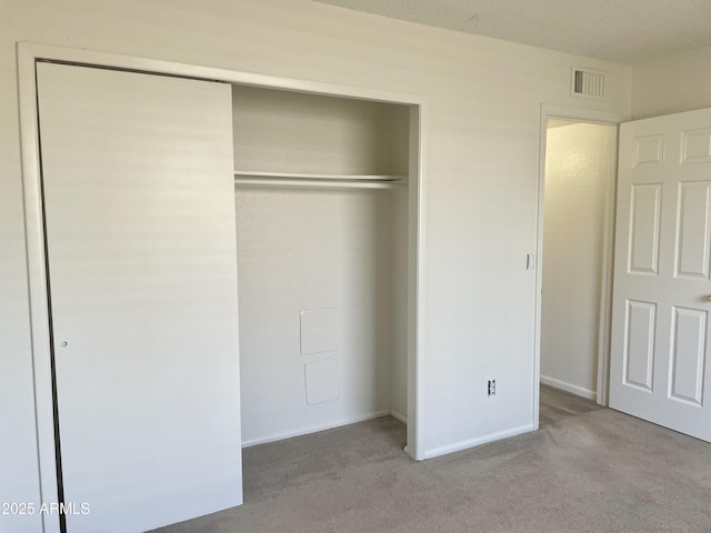 143 S Mountain Rd, Apache Junction, AZ 85120 - unfurnished bedroom featuring a closet and carpet flooring