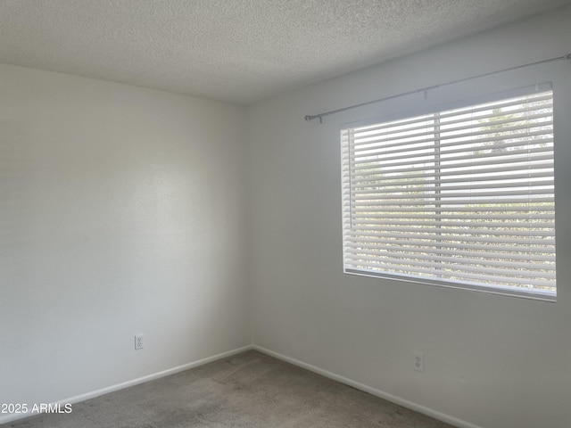143 S Mountain Rd, Apache Junction, AZ 85120 - carpeted spare room featuring a textured ceiling and baseboards