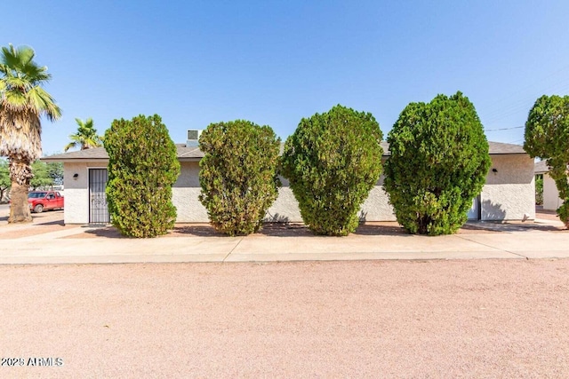 143 S Mountain Rd, Apache Junction, AZ 85120 - obstructed view of property with stucco siding