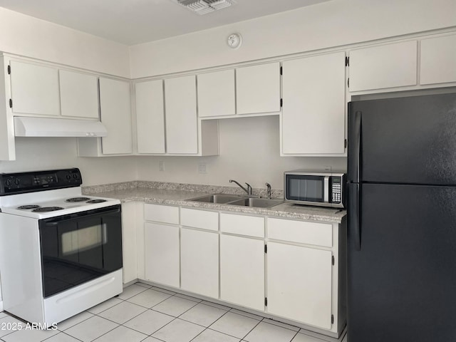 143 S Mountain Rd, Apache Junction, AZ 85120 - kitchen with freestanding refrigerator, white range with electric stovetop, stainless steel microwave, under cabinet range hood, and light countertops