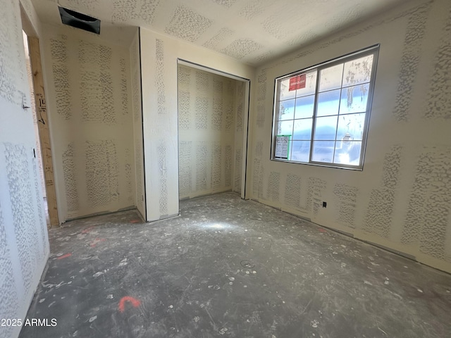 unfurnished bedroom featuring a closet