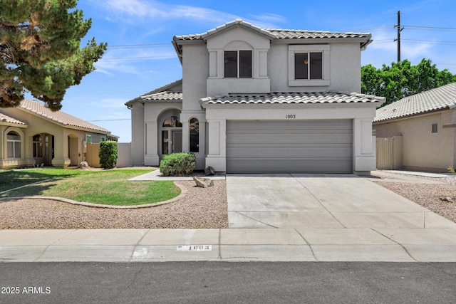 1003 E Princeton Ave, Gilbert, AZ 85234 - mediterranean / spanish-style home featuring a tile roof, a garage, stucco siding, and driveway