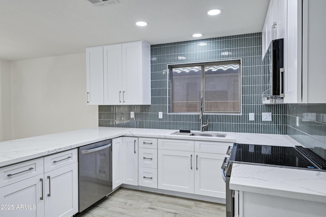 1003 E Princeton Ave, Gilbert, AZ 85234 - kitchen with stainless steel dishwasher, electric range, white cabinets, and recessed lighting
