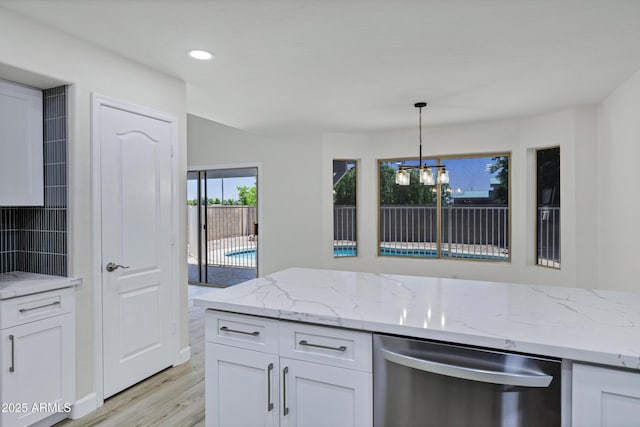 1003 E Princeton Ave, Gilbert, AZ 85234 - kitchen with dishwasher, light wood finished floors, white cabinets, light stone counters, and a chandelier