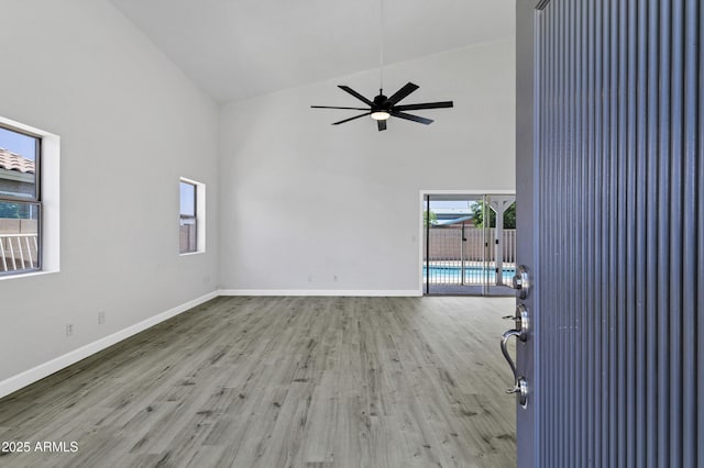 1003 E Princeton Ave, Gilbert, AZ 85234 - empty room featuring high vaulted ceiling, wood finished floors, and a ceiling fan
