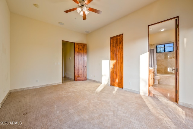 unfurnished bedroom with light carpet and ensuite bath