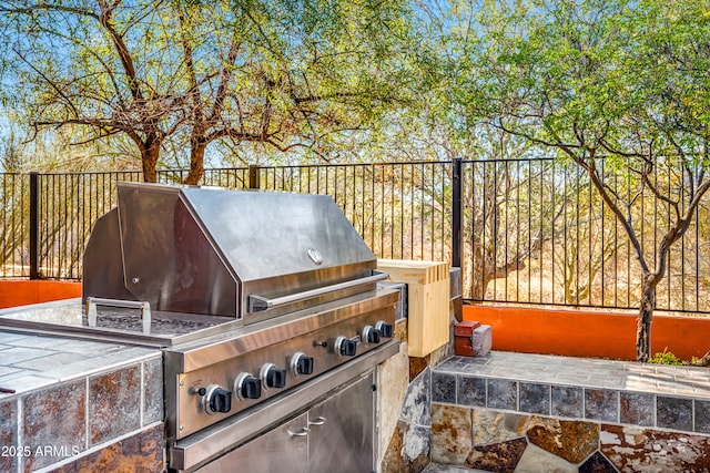 view of patio with a grill and exterior kitchen