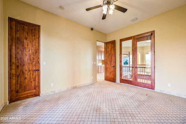 empty room with light colored carpet, french doors, and ceiling fan