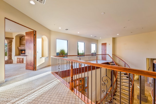 hallway featuring light carpet