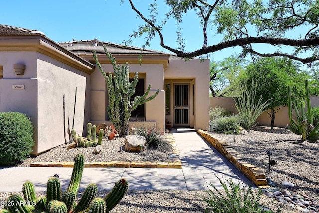 6966 E Bramble Berry Ln, Scottsdale, AZ 85266 - view of exterior entry with stucco siding