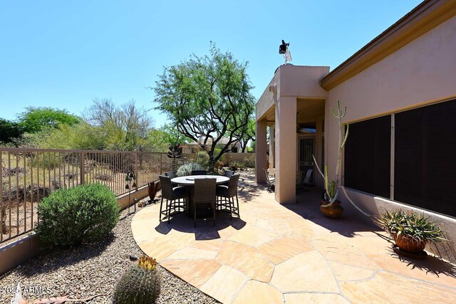 6966 E Bramble Berry Ln, Scottsdale, AZ 85266 - fenced backyard featuring outdoor dining space and a patio