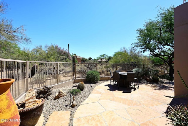 6966 E Bramble Berry Ln, Scottsdale, AZ 85266 - fenced backyard with outdoor dining space and a patio area