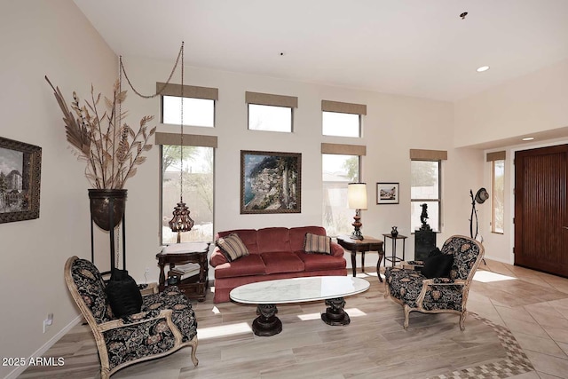 6966 E Bramble Berry Ln, Scottsdale, AZ 85266 - living room with a towering ceiling, recessed lighting, and baseboards