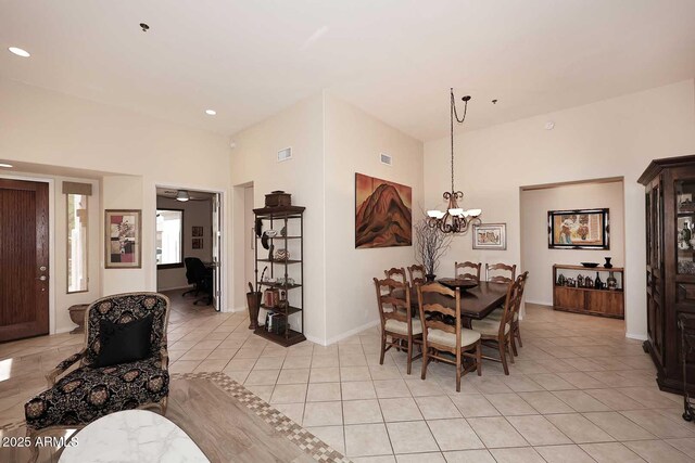 6966 E Bramble Berry Ln, Scottsdale, AZ 85266 - dining room with recessed lighting, light tile patterned floors, a high ceiling, a chandelier, and baseboards