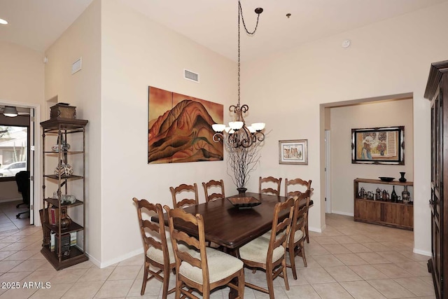 6966 E Bramble Berry Ln, Scottsdale, AZ 85266 - dining room with a chandelier, light tile patterned floors, baseboards, and a high ceiling