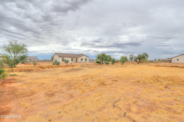 view of yard with a rural view