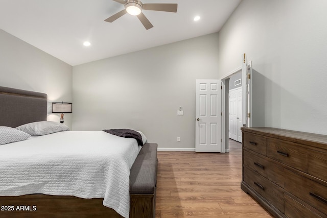 bedroom with ceiling fan, recessed lighting, baseboards, vaulted ceiling, and light wood-type flooring