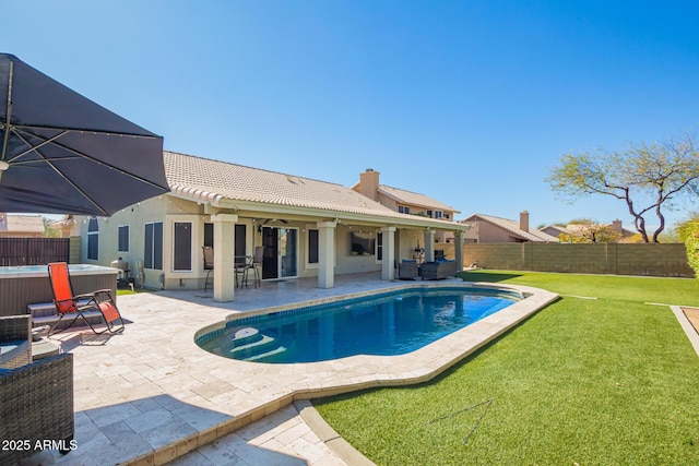 view of pool featuring a patio, a fenced backyard, an outdoor living space, a lawn, and a hot tub