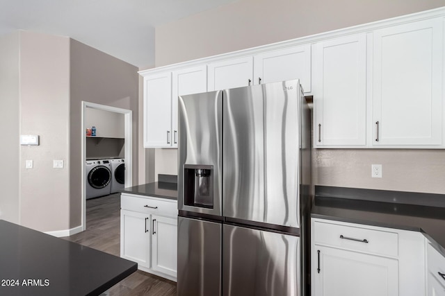 kitchen with washer and clothes dryer, white cabinetry, stainless steel refrigerator with ice dispenser, and dark wood-type flooring